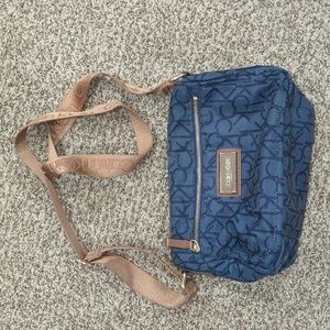 Calvin Klein navy blue ck printed fabric crossbody purse tan strap